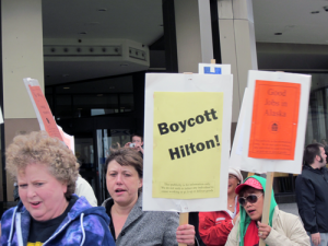 Protestors assemble outside the Hilton Hotel in Anchorage in August 2011. Photo by Ellen Lockyer, KSKA - Anchorage