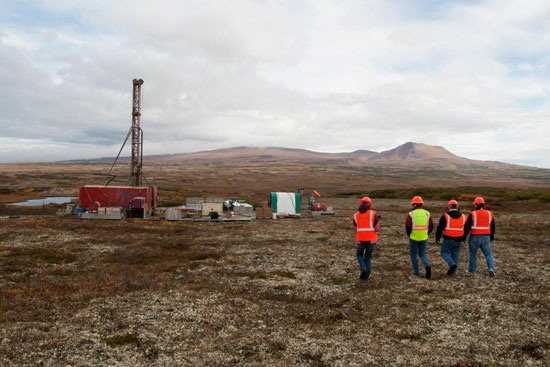Members of the media walking to an exploratory drill rig. Photo by Jason Sear, KDLG - Dillingham