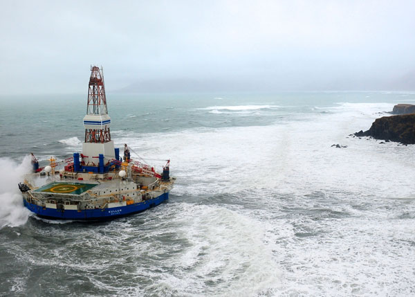 The conical drilling unit Kulluk sits aground on the southeast shore of Sitkalidak Island about 40 miles southwest of Kodiak City, Photo courtesy of the U.S. Coast Guard.