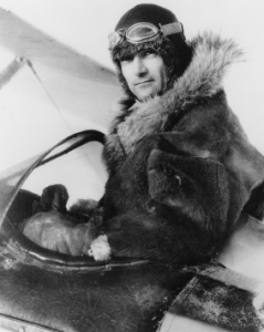 Harold Gillam, in the cockpit of his ski-equipped Waco.