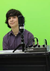 Kenny Petrini preparing for Friday morning announcements at Central Middle School.  Photo by Alexander Duerre. 