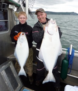 A father and son with their charter-caught halibut summer 2010.