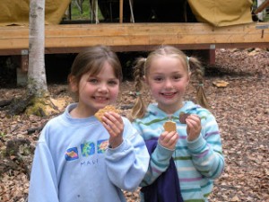 Girls enjoying s'mores at Camp Togowoods near Wasilla.