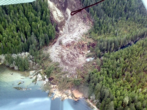 The path of a 2013 landslide shows destruction and debris left from where a Forest Service cabin used to stand. 