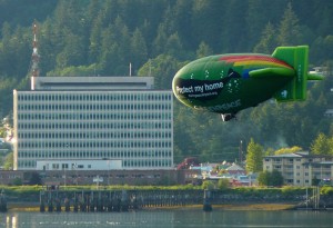 A Greenpeace airship promoting the group’s Bering Sea Canyons protection initiative sails over Juneau’s Gastineau Channel Saturday evening. Photo by Ed Schoenfeld, CoastAlaska News.