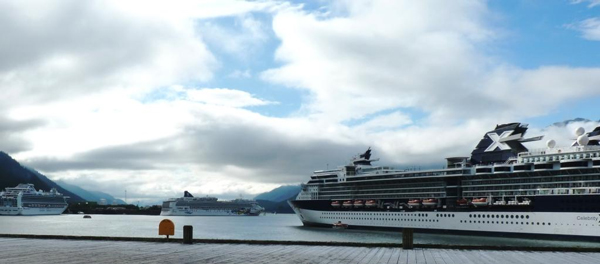 Three cruise ships tie up in Juneau’s Gastineau Channel on Tuesday morning. Lines serving Alaska were among those defending the industry during a U.S. Senate Commerce Committee hearing on Wednesday. Photo by Ed Schoenfeld/CoastAlaska News.