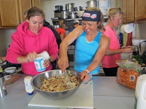 Olympian Holly Brooks and a teammate prepare a meal during the camp. (Photo by Annie Feidt, APRN - Anchorage)