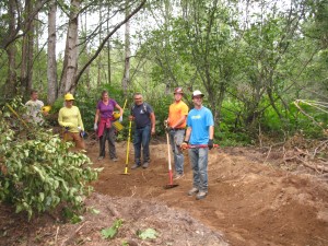  Volunteers from the Singletrack Advocates shaping a turn on the new trails at Kincaid Park.