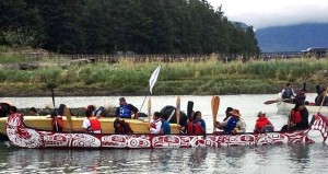 One of the Gathering Strength Canoe Journey vessels floats next to an accompanying boat along the way. Photo courtesy Diane Raymond Stewart of Kingcolith, B.C.