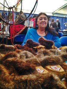 1.Donna Pulliam of Chugiak sells handmade, beaded slippers and other work at the AFN convention. Photo by Emily Schwing, KUAC - Fairbanks.