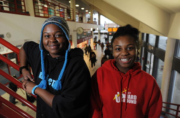 Judy Ayers, 19, left, and Calesia Monroe, 16, are outreach workers at Alaska Youth Advocates on the second floor of the Downtown Transit Center where they work with homeless teenagers. Photo by Bill Roth, Anchorage Daily News.
