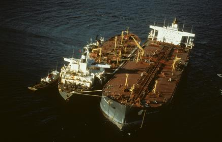 Exxon Valdez tanker aground. Off-loading of remaining oil in progress. Photo courtesy of the Exxon Valdez Oil Spill Trustee Council.