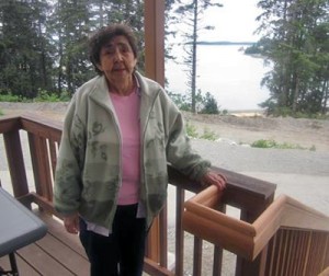 Elder Marge Adams stands on the porch at the new Yakutat Senior Center. Photo courtesy Tlingit and Haida Regional Housing Authority.