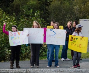Students and parents protest the middle school sports travel ban during a school summit at Thunder Mountain High School last month. About 40 people protested. Photo by Heather Bryant, KTOO - Juneau.