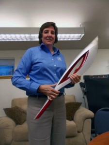 Pat Pitney and her Olympic Torch. Photo by Dan Bross, KUAC - Fairbanks.