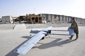 U.S. Army Spc. Joseph Anderson, with Headquarters and Headquarters Troop, Combined Task Force Dragoon, pushes an RQ7B Shadow Technical Unmanned Aircraft System to a mechanical station for post-flight checks at Forward Operating Base Pasab, in Kandahar Province, Afghanistan, Sept. 12, 2013. The aircraft was used for aerial reconnaissance and mission communications. (U.S. Army Photo by Spc. Joshua Edwards/Released)