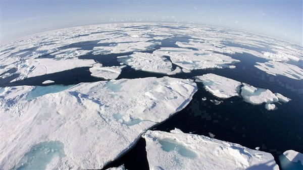 Ice floes float in Baffin Bay between Canada and Greenland above the Arctic circle on July 10, 2008. The seven lowest levels of sea ice cover have all been recorded in the last seven years. Photo by Jonathan Hayward, Canadian Press.