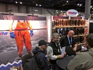 XtraTuf reps telling fishermen at the Pacific Marine Expo in Seattle that their boots are not just "sort of tough" anymore. Photo courtesy KDLG.
