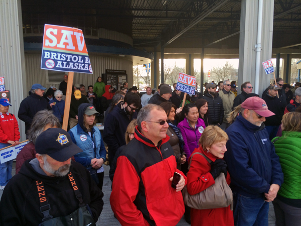 People pray at Fisherman's Terminal in Seattle, before the start of a rally opposing a mining project in western Alaska. Fishermen in Washington say the project threatens salmon in Bristol Bay, where about 1,000 Washingtonians have permits to fish. Photo by Ed Ronco, KPLU - Seattle.