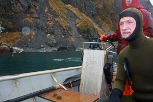 Dan Magone and his sea urchins in the skiff after the survey dive. Photo by Annie Ropeik, KUCB - Unalaska.