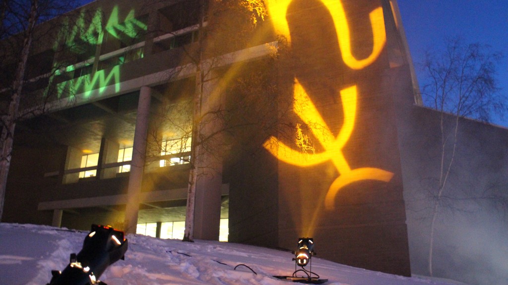 Glyphs projected on to the library facade.