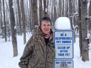 Cherie Norton poses near one of the posted warning signs.
