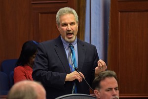 On the Alaska Senate floor, Sen. Pete Kelly addresses criticism of his interest in putting pregnancy tests in bars to reduce fetal alcohol syndrome, March 24, 2014. (Photo by Skip Gray/Gavel Alaska)