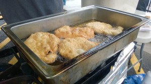 Fry bread cooks in canola oil. Cheaper oils make the fry bread come out greasier, Garfield Katasse says. (Photo by Jeremy Hsieh/KTOO)