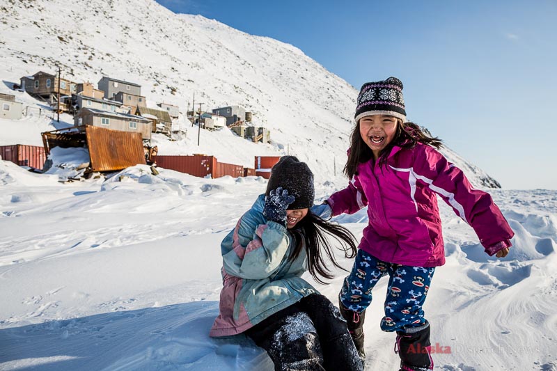 Children play on the sea ice in Diomede, Alaska on March 13, 2013. They can't stray too far from the village, lest they either meet a polar bear or cross the International Date Line, a mere 1 mile away.