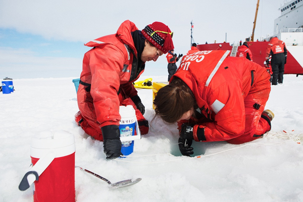 Researchers collect water samples in the Chukchi Sea. (Courtesy of Amanda Kowalski/ArcticSpring.org)