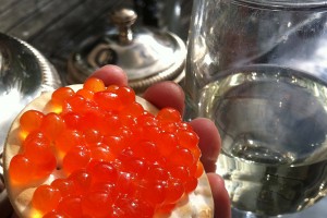 A cracker loaded with Fresh King Salmon Caviar. (Photo courtesy CaviarMania)