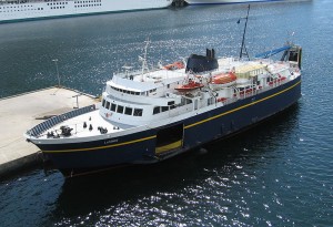 A blue ferry with a white deck as seen from above