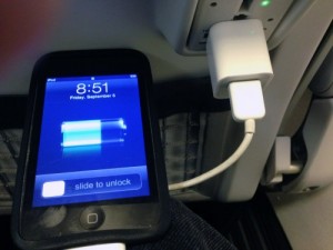 The new Alaska Alaska Airlines Recaro seats include plug-ins for phones, computers and similar devices. (Ed Schoenfeld, CoastAlaska News)