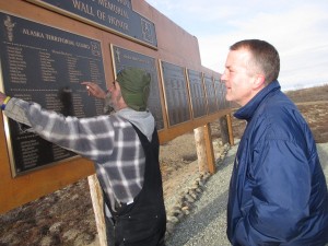 Sullivan visits the ATG Memorial Park Wall of Honor. (Photo by Ben Matheson / KYUK)