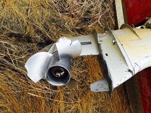 A broken outboard prop with significant damage to tabs on the lower unit. (Photo by Roderick Phillip)