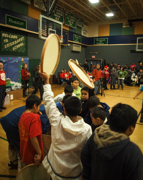 Boys eagerly grabbed at drums after the adults had taken up their own, and took turns drumming and dancing. Photo: Zachariah Hughes, KSKA.