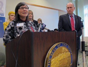 Health Commissioner Valerie Davidson and Alaska Gov. Bill Walker announce the state's plan for Medicaid expansion and reform. (Photo by Annie Feidt, APRN - Anchorage)
