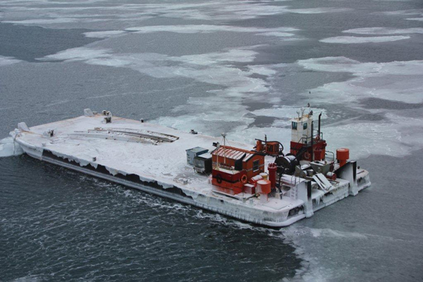 The barge was already partially ice-bound on Oct. 31, 2014, as seen from a Coast Guard aircraft in Alaska's Arctic. (Courtesy: Cmdr. Shawn Decker/USCG)