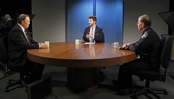 Anchorage Assembly member Paul Honeman (left) and Anchorage Police Department Chief Mark Mew (right) talk with Zachariah Hughes (center) on Alaska Edition. (Photo by Josh Edge, APRN, Anchorage)