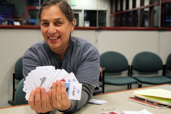 Nancy Keen holds out Tlingit flash cards. (Photo by Lisa Phu/KTOO)