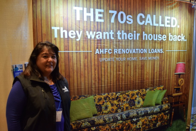 Jan Miyagishima at the AHFC booth at the Juneau Home and Outdoor Living Expo. (Photo By Casey Kelly. KTOO-Juneau)