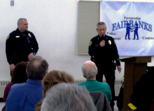 Fairbanks Police Officer Richard Sweet, left, and Chief Randall Aragon explain community policing at Tuesday night's meeting at the J.P. Jones Community Center in South Fairbanks. (Credit Tim Ellis/KUAC)