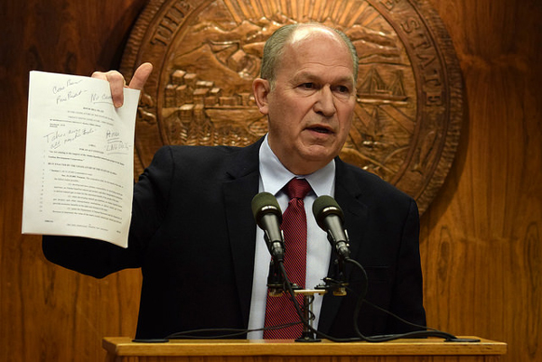 In a press conference March 2, 2015, Gov. Bill Walker holds up a copy of House Bill 132 that would limit the Alaska Gasline Development Corporation's powers on the Alaska Stand Alone Pipeline. House leaders introduced it earlier that day. The governor was adamant that the bill would hinder rather than help progress for the project by tying the state’s hands during negotiations. (Photo by Skip Gray/360 North)