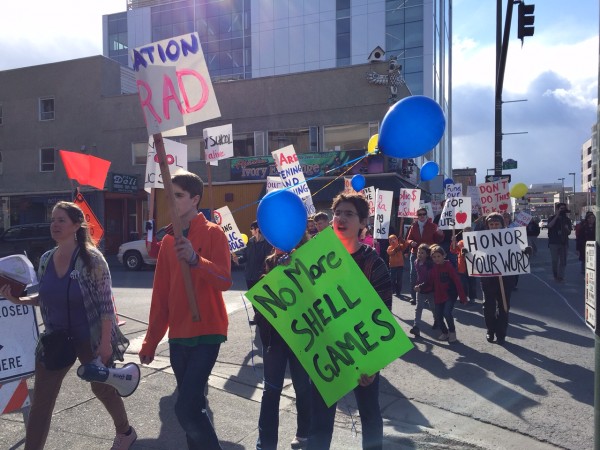 Community members walk through downtown Anchorage to protest education funding cuts. Hillman/KSKA