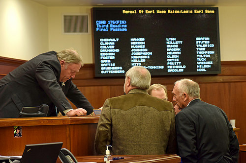 House Speaker Mike Chenault, R-Nikiski (left) confers with other members of the House leadership just before the vote on House Bill 176, April 15, 2015. The bill repeals a 2.5 percent pay raise for state employees scheduled to take effect July 1, 2015. (Photo by Skip Gray/360 North) 