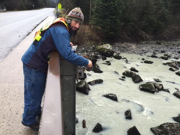 Hydrologist Aaron Jacobs takes the final Mendenhall River reading of 2014 in November. (Photo courtesy National Weather Service)