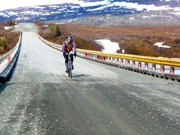 A biker chugs along the Denali Highway. Photo: Alaska Endurance Association.