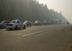 Troopers stop traffic on the Parks Highway Monday morning as the Sockeye Fire spreads. (Photo by John Norris - Alaska Public Media)