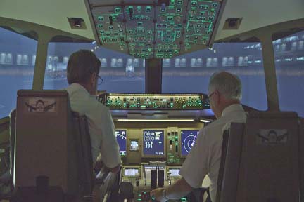 Pilots flying simulator (L to R) Less Abend and Mark Weiss. (Photo Courtesy of WGBH)