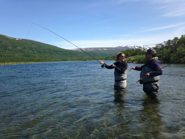David Parks Jr. gives some casting tips to his client Sarah Pearl in the Kulik River. Credit Matt Martin/KDLG